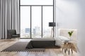 Modern bedroom interior with window and city view and wooden furniture. Royalty Free Stock Photo
