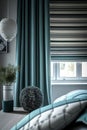 Modern bedroom with stylish striped Roman shades Royalty Free Stock Photo