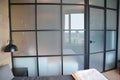 Modern bedroom zoning with glass wall. Modern bedroom interior with cozy glass wall and door