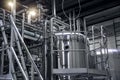 Modern beer factory, brewery. Steel tanks and pipes for beer production. Industrial background Royalty Free Stock Photo