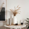 Modern beige ceramic vases with dry grass branches on white table near a black white wall backdrop. Copy space.Minimal Scandinavia