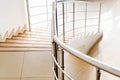 Modern beige office staircase with chrome handrails Royalty Free Stock Photo