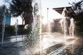 Modern and beutifull waterfall with sun in the back. Water drops dancing Royalty Free Stock Photo