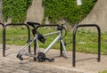 Modern bicycle frame locked to stand but missing wheels