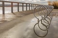 Modern bicycle rack with reflection after rain on the street of a city Royalty Free Stock Photo