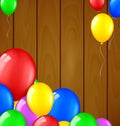 Modern birthday balloons on wooden background