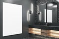 Modern black bathroom interior with empty mock up banner on wall, washbasin and mirrors. Royalty Free Stock Photo