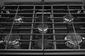 Modern built-in gas cooktop. Gas oven hob with gas burners and grate kitchen stove. Black Gas cooker