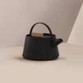 Modern black cast iron teapot with colorful minimalist background beige, art set for tea time. 3d rendering