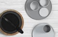 Modern black cast iron teapot and tea cups and a minimalist table wood white. Top view, set for tea time. 3d rendering Royalty Free Stock Photo