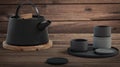 Modern black cast iron teapot and tea cups and a minimalist wood table. side view, set for tea time. 3d rendering Royalty Free Stock Photo