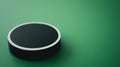 Modern black circular device on green background
