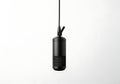 Modern black condenser microphone suspended against a white background Royalty Free Stock Photo