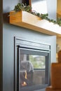 Modern Black Fireplace and Wooden Mantle