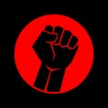 modern black fist with a hand as a sign of the struggle for any human rights on a red circle on a black background Royalty Free Stock Photo