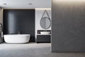 Modern black hotel style bathroom interior with blank mock up place on wall.
