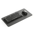 Modern black keyboard and mouse on a large desk mat Royalty Free Stock Photo