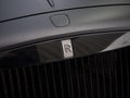 Modern black Rolls Royce Phantom car, front grill / hood and insignia. Royalty Free Stock Photo