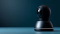 Modern black security camera with spherical lens on blue surface and dark background, technology and surveillance concept Royalty Free Stock Photo