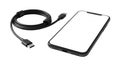 Modern black smartphone with a blank white screen alongside a coiled black USB-C charging and data cable, isolated on white & Royalty Free Stock Photo