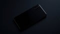 Modern black smartphone with dual camera. Sleek tech device on dark background. Simple design. Concept of advanced tech Royalty Free Stock Photo