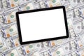 Modern black tablet pc with blank white screen on dollars