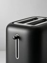 Modern black toaster in minimalistic kitchen setting. Royalty Free Stock Photo