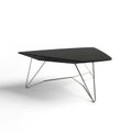 A modern black triangular coffee table with a chrome wire frame base on a white background Royalty Free Stock Photo