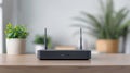 A modern black WiFi router with dual antennas placed on a wooden table, with a green plant in the background