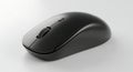 Modern black wireless computer mouse on white studio background Royalty Free Stock Photo