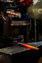 Modern blacksmith working in his shop Royalty Free Stock Photo
