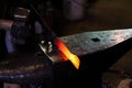 Modern blacksmith working in his shop Royalty Free Stock Photo
