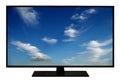 Modern blank flat screen TV set, LCD Television isolated on white background,4K display with blue sky and clouds Royalty Free Stock Photo