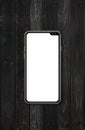 Modern blank smartphone mockup on black wood desk. 3D render