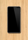 Modern blank smartphone mockup on wooden desk. 3D render Royalty Free Stock Photo
