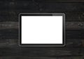Modern blank tablet pc computer mockup on black wood desk. 3D render Royalty Free Stock Photo