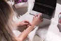 Modern blogger workplace. Lady typing on laptop