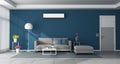 Modern blue living room with gray furniture and air conditioner Royalty Free Stock Photo