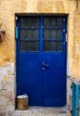 Modern blue metal door with window and openwork a beautiful vintage background Royalty Free Stock Photo