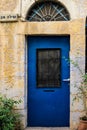 Modern blue metal door with window and openwork a beautiful vintage background