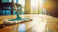Modern blue mop with microfiber standing on the wooden parquet floor. Process of cleaning room. Concept supporting house hygiene Royalty Free Stock Photo