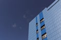 Modern blue office building against blue sky. Royalty Free Stock Photo
