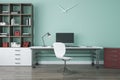 Modern blue office interior with bookcase, workplace with computer, other items and wooden flooring.