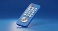 Modern blue remote control with illuminated power button Royalty Free Stock Photo