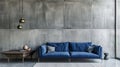 Modern blue sofa against a textured concrete wall in a stylish living room