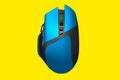 Modern blue wireless gaming computer mouse isolated on yellow background Royalty Free Stock Photo