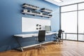 Modern blue workplace with ÃÂomputer on table Royalty Free Stock Photo