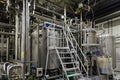 Modern brewing equipment in beer factory, steel vats for fermentation and maturation of beverage Royalty Free Stock Photo