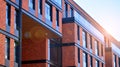 Architectural exterior detail of residential apartment building with brick facade. Royalty Free Stock Photo