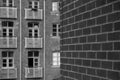 Modern brick residential building with balconies in black and white Royalty Free Stock Photo